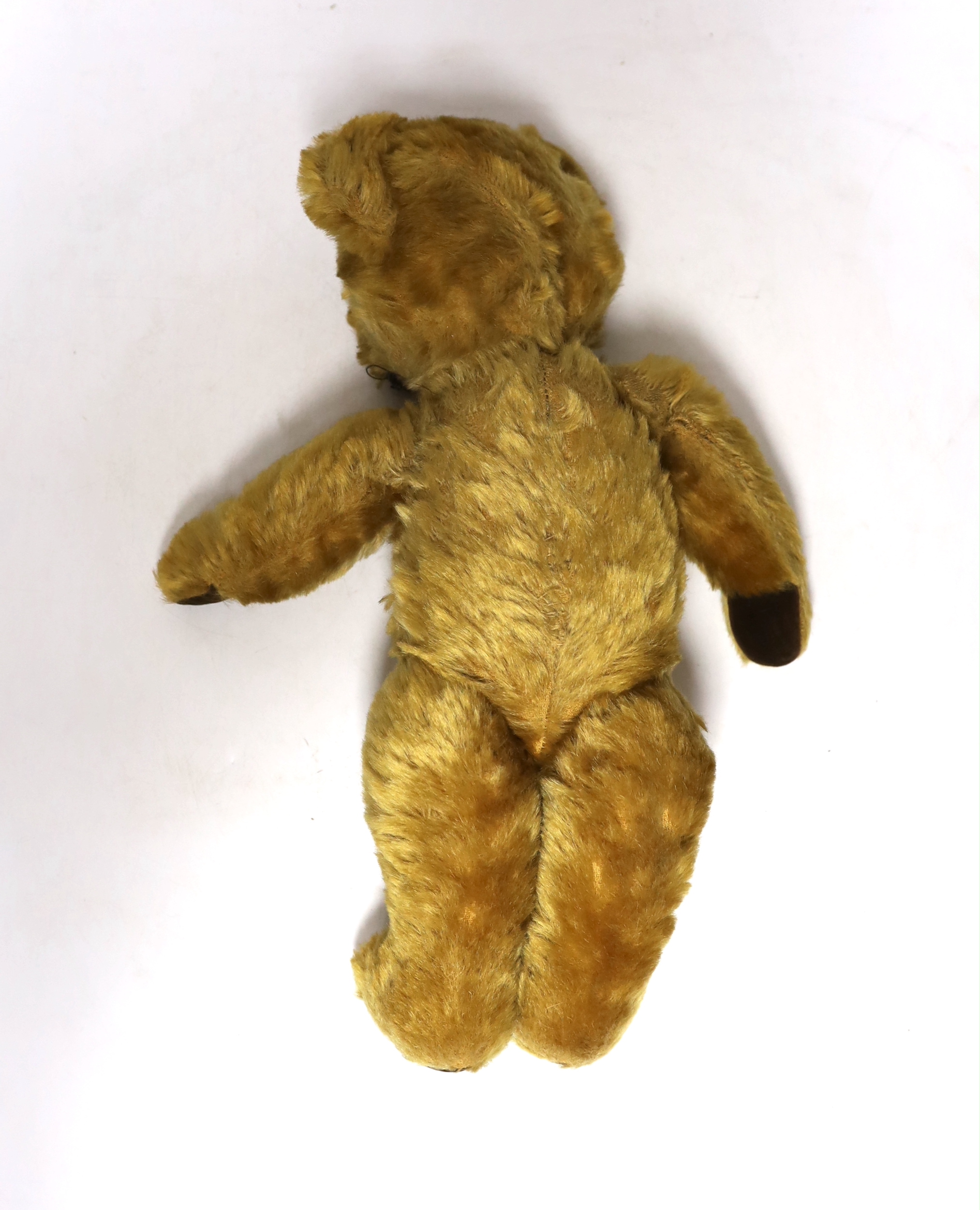 A mid 20th century teddy bear, probably Merrythought, 37cm high